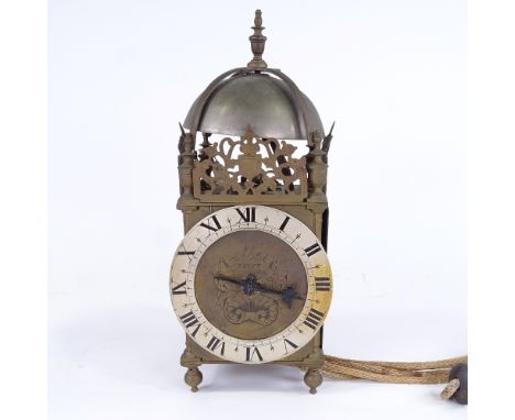 A late 19th/early 20th century brass-cased lantern clock, dial inscribed James Pool, silvered chapter ring with Roman numeral