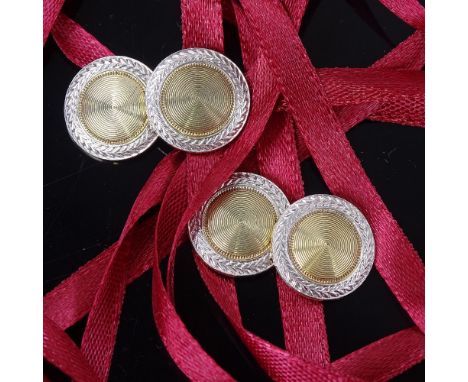 A pair of late 20th century 14ct gold disc panel cufflinks, engine turned decoration with arrowhead borders, panel diameter 1