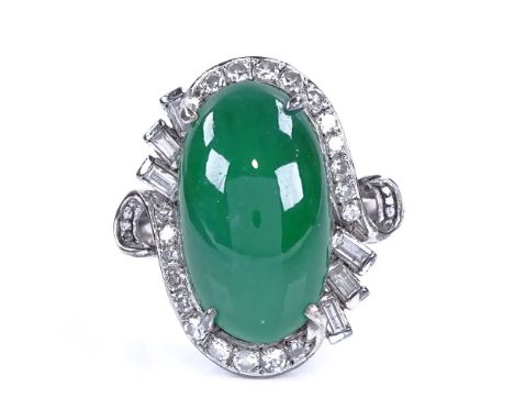 A cabochon jadeite and diamond cluster ring, set with large central cabochon jadeite, surrounded by baguette and round-cut di