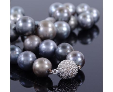 A modern single-strand Princess length black pearl necklace, with 14ct white gold diamond set clasp, largest pearl diameter 1