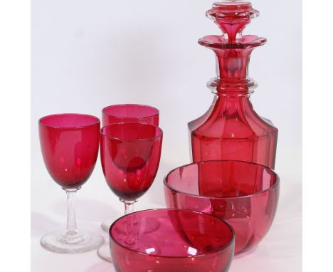 A cranberry glass decanter, two cranberry glass finger bowls and three glasses, decanter height 23cm. (5)Decanter - a ground 