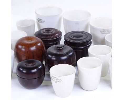 A group of 5 small treen pots, largest height 4cm, and a group of Royal Worcester ceramic thimble shaped strainers 