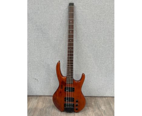 A Hohner 'Jack Bass' four string electric bass guitar with Steinberger system tuners to bridge, active, natural wood body, ha