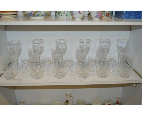 A shelf of drinking glasses.