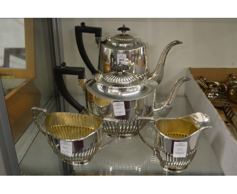A plated four piece tea and coffee service.