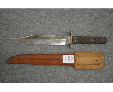 A Wilkinson bowie knife with leather scabbard.