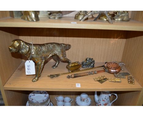 A cast brass model of a dog and other items.