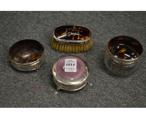 A silver and enamel decorated circular jewellery box on three feet and three similar items.