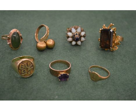 A Chinese yellow metal signet ring stamped 14k and a collection of other rings.