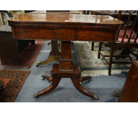 A 19th century mahogany D shaped fold over card table on column support with splay legs.