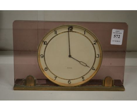 A stylish desk or mantle clock.