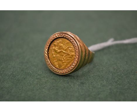 A gentlemen’s half sovereign ring with 9 carat gold mount.