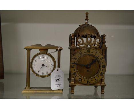 A small Swiza bedside clock and a miniature lantern clock.