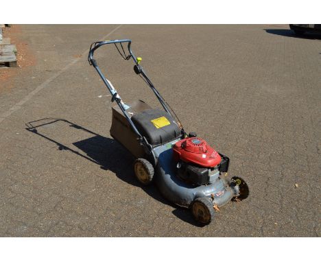A Honda petrol rotary lawn mower.
