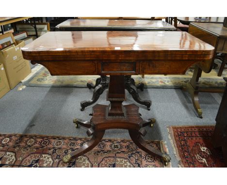 A 19th century mahogany fold over card table on column support with splay legs.