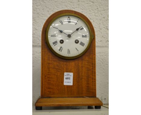 A mahogany mantle clock.
