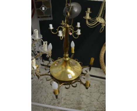 A brass six light chandelier.