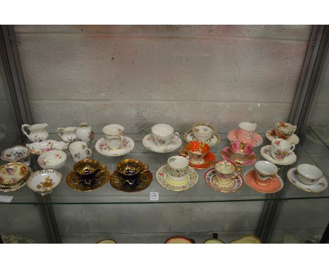 A quantity of porcelain cups and saucers and other decorative china.
