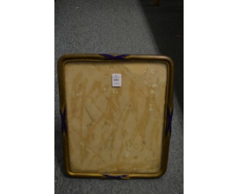 A brass and enamel photograph frame.