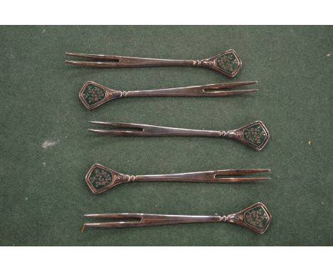 Five Chinese white metal and enamel forks.