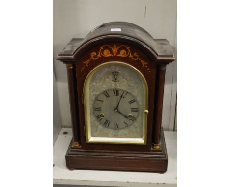 A mahogany cased mantle clock.