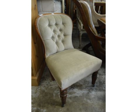 A Victorian button upholstered bedroom chair.