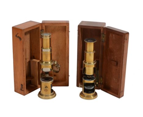  Two similar Victorian lacquered brass field microscopes Both unsigned, late 19th century  Each of stepped cylindrical form w