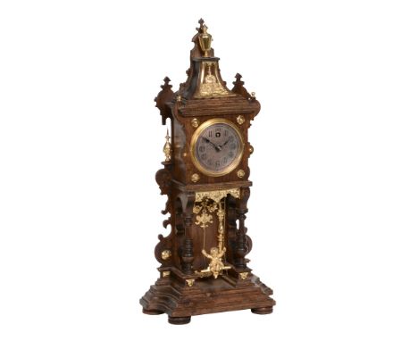  A German gilt metal mounted walnut 'swinging cherub' mantel timepiece Lenzkirch, Germany, circa 1905  The small single train