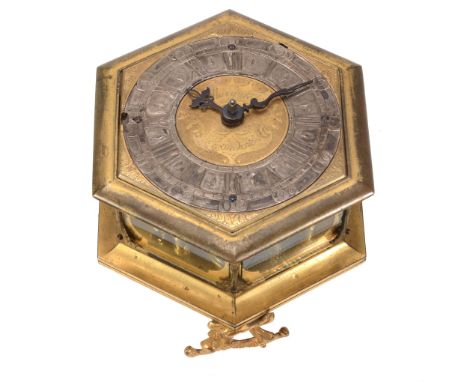  A fine Germanic gilt brass hexagonal horizontal striking table clock Signed for 'Marquick', London, early 18th century  The 