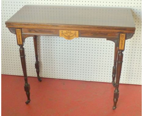 ROSEWOOD CARD TABLE WITH A FOLDING RECTANGULAR TOP, GREEN BAIZE WITH TOOLED LEATHER SURROUND ON TURNED TAPERING LEGS (WHEN CL