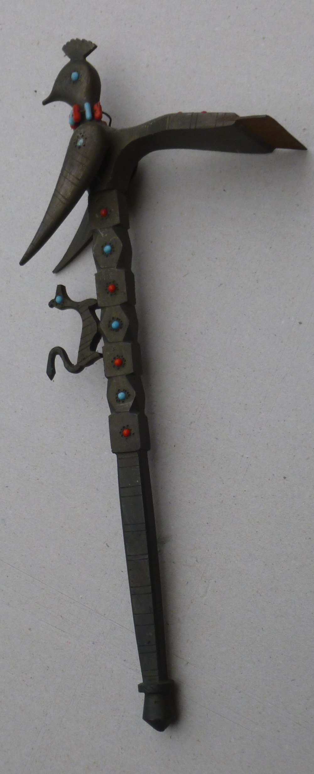 A BRASS SUGAR CUTTER OR SUGAR HAMMER, ADZE SHAPED WITH A SHARP METAL