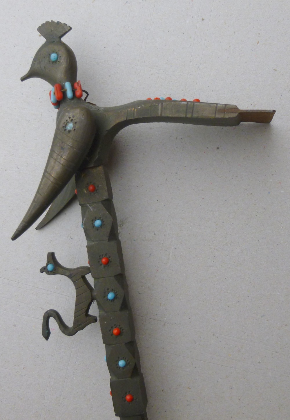 A BRASS SUGAR CUTTER OR SUGAR HAMMER, ADZE SHAPED WITH A SHARP METAL