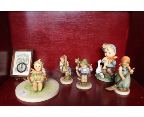 Hummel ornaments and a miniature Hummel clock