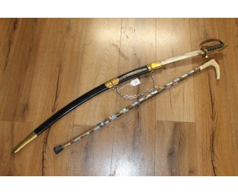 A horn handled walking stick with badges and a Fullered Sword with leather sheaf and scabbard  