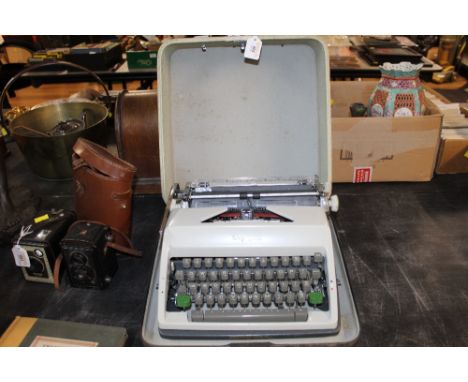 A vintage cased Olympia typewriter 