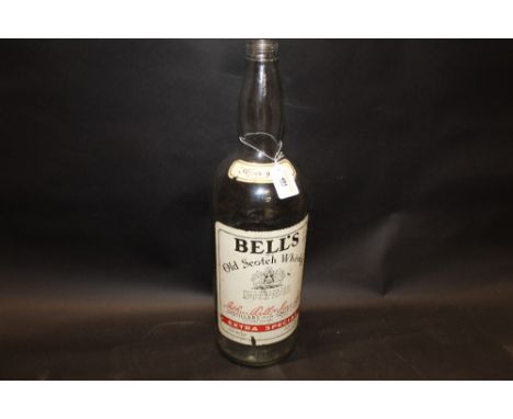 A large decorative Bells Old Scotch Whisky bottle  