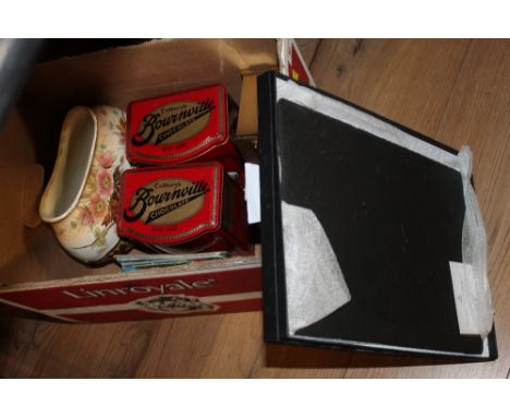 Box of The Just Slate Co. place mats, Cadbury's chocolate tins, floral vase and quartz Metamec carriage clock 