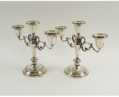 CANDELABRA, a pair, sterling silver, each with three sconces and circular bases, 22cm H maximum. 