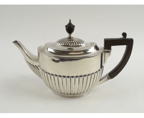 SILVER TEAPOT, Edwardian, with part gadrooned decoration, ebonised handle and finial, hallmarked London 1914, total weight 16