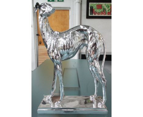 GREYHOUND, chrome finish model of greyhound on integral plinth, 43cm W x 85cm H. 