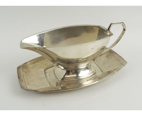 SILVER SAUCE BOAT AND STAND, 21cm L and 21.5cm L respectively hallmarked Birmingham 1939, makers William Adams Ltd, total wei