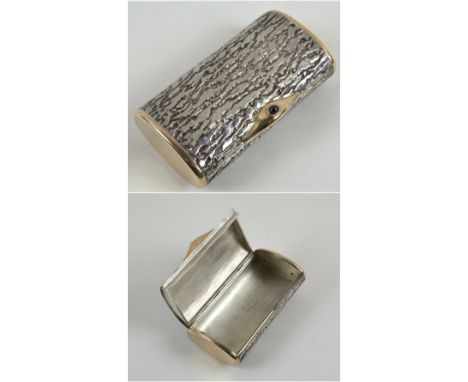 BOUCHERON SILVER CIGARETTE BOX, of lidded elliptical form and 'bark' finish with gilt ends and faux jewel clip, engraved 'Bou