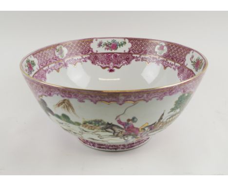 FAMILLE ROSE PUNCH BOWL, late 20th century Chinese ceramic decorated hunting scenes in reserved panels, 36cm diam x 16.5cm H 