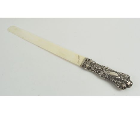 PAGE TURNER, Victorian with foliate embossed silver handle hallmarked Birmingham 1895, the ivory blade inscribes 'April 22nd,