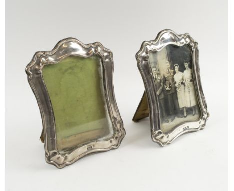 SILVER PHOTOGRAPHIC FRAMES, a pair, Edwardian Sheffield 1903, makers Walker & Hall, each 18cm H x 13cm max. (2) (with faults)