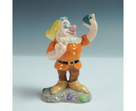 This Royal Doulton figurine is part of the Disney Showcase Collection in collaboration with Walt Disney. It features Doc, one