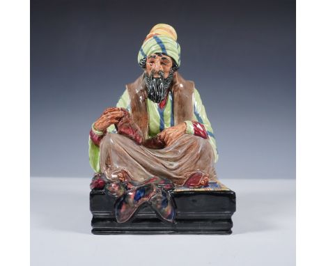 Charming Royal Doulton figurine titled Cobbler, model HN1706, depicting a seated shoemaker in traditional Middle Eastern atti