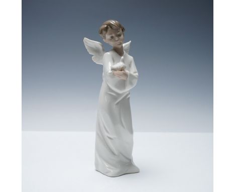 Graceful porcelain figurine by Nao, a division of Lladro, titled Angel with Dove, model number 1261. This elegant piece depic