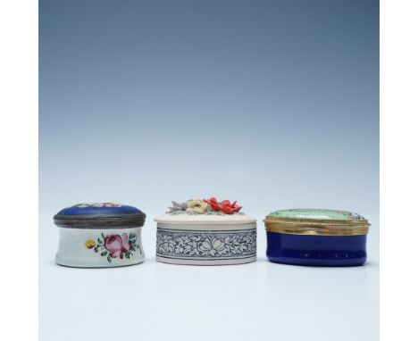This lot features three vintage trinket boxes, each with distinct craftsmanship and style. Included is a Handcast Designs Lim