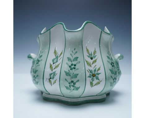 A hand-painted Italian ceramic cachepot featuring a gracefully scalloped rim and twin side handles. Decorated with a charming